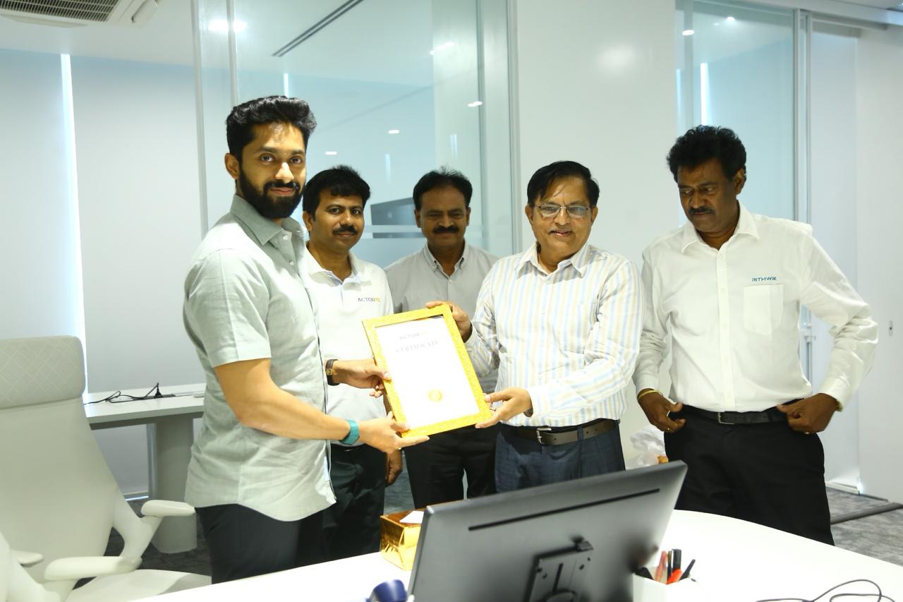 Actoryx presenting framed AI training certificate to Rithwik participant