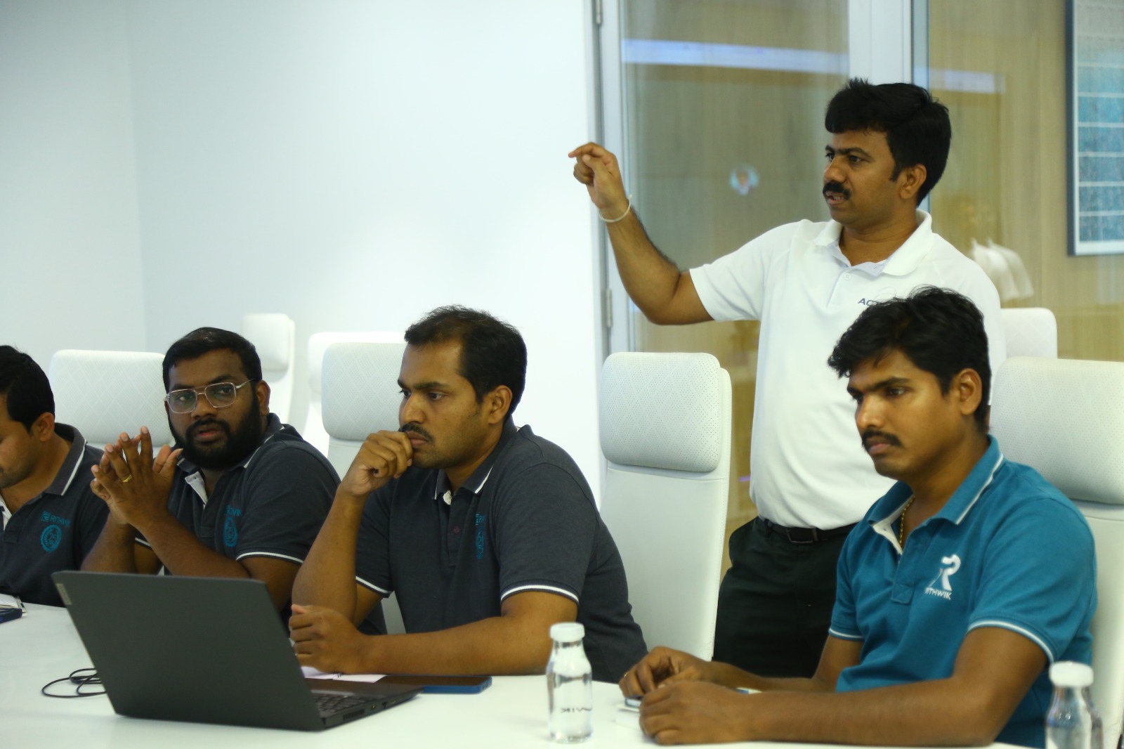 Actoryx trainer pointing at key AI concept while participants follow along